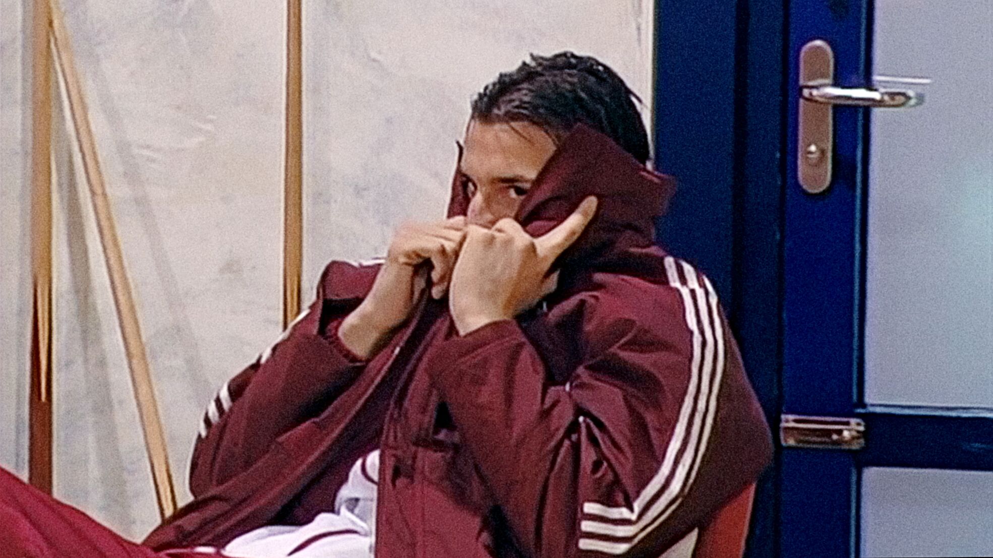 Teenage Zlatan hiding behind his jacket at Ajax