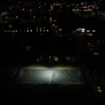 Courts of Belonging (2024) - Aerial view of Kenedy Park futsal court at night. Screenshot from the film.